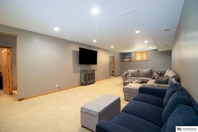living area with baseboards, light carpet, recessed lighting, and visible vents