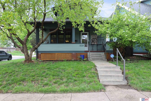 view of front of property with a porch and a front yard