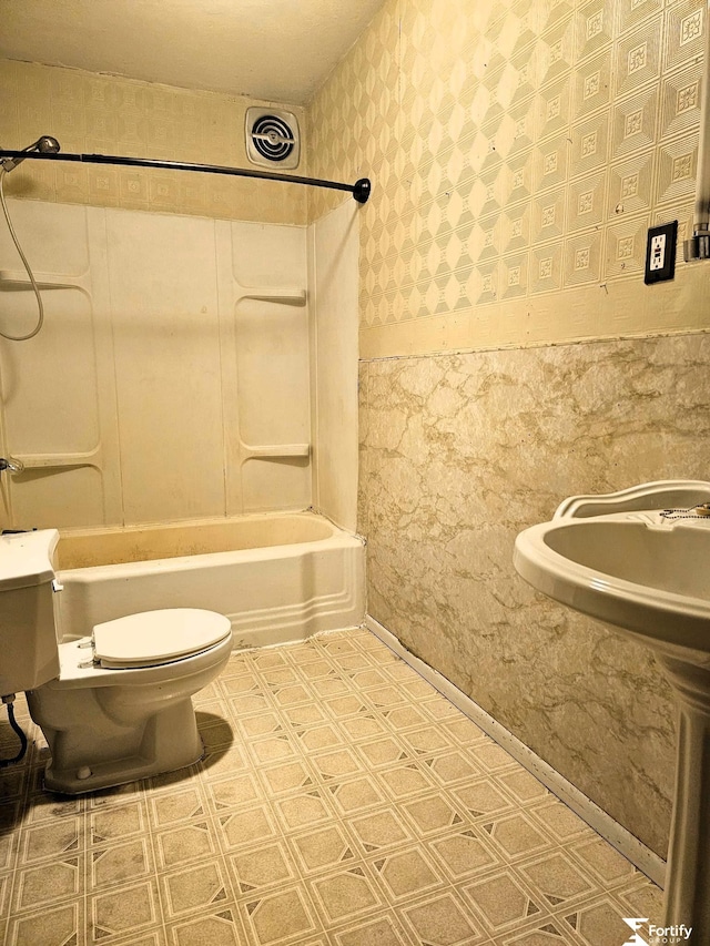 bathroom with tile patterned floors, toilet, visible vents, bathtub / shower combination, and wallpapered walls