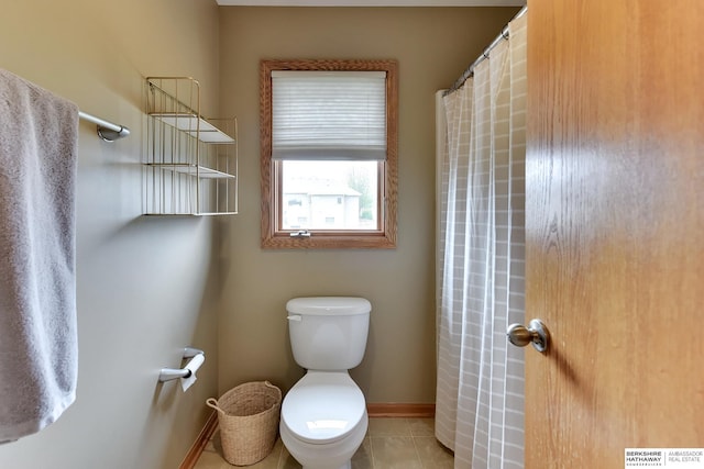full bathroom with toilet, tile patterned floors, baseboards, and a shower with curtain