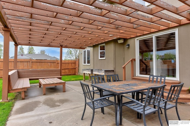 view of patio / terrace with fence, outdoor dining space, and a pergola