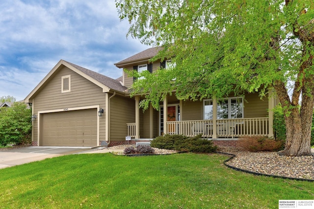 view of front of home with a shingled roof, an attached garage, a front lawn, covered porch, and driveway