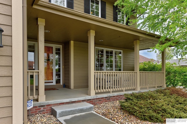 doorway to property featuring a porch