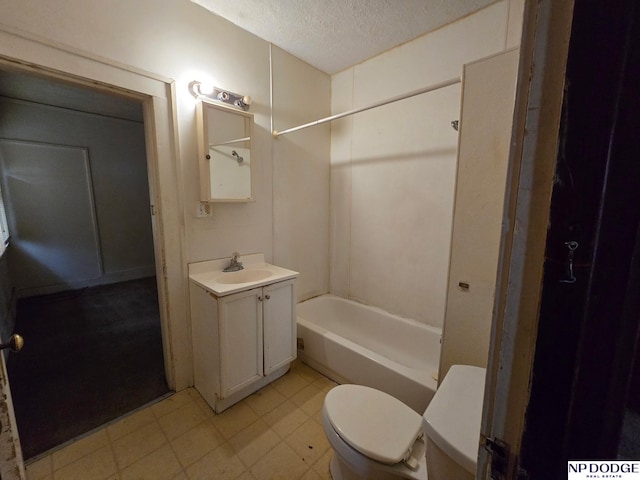 full bathroom with a textured ceiling, toilet, tile patterned floors, shower / washtub combination, and vanity