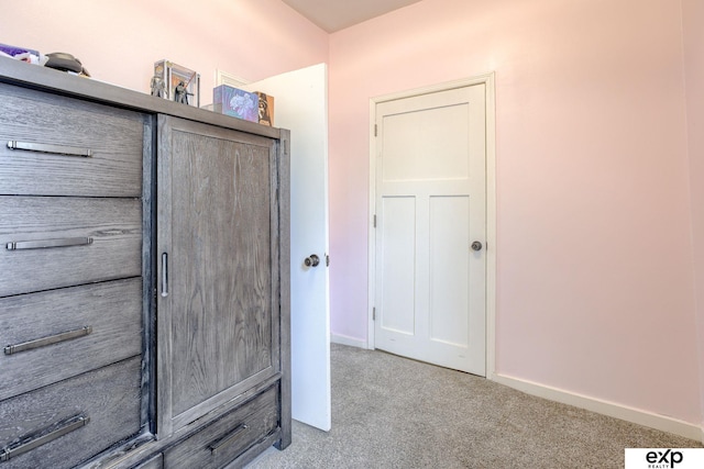 interior space featuring baseboards