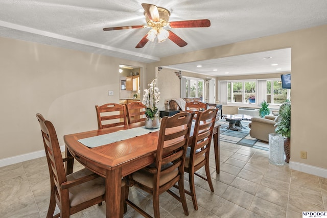 dining room with baseboards, recessed lighting, and ceiling fan