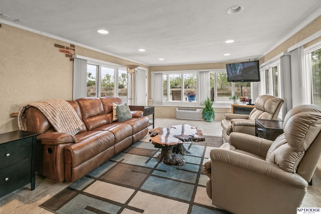 living room featuring recessed lighting, a wall mounted air conditioner, crown molding, and a textured wall