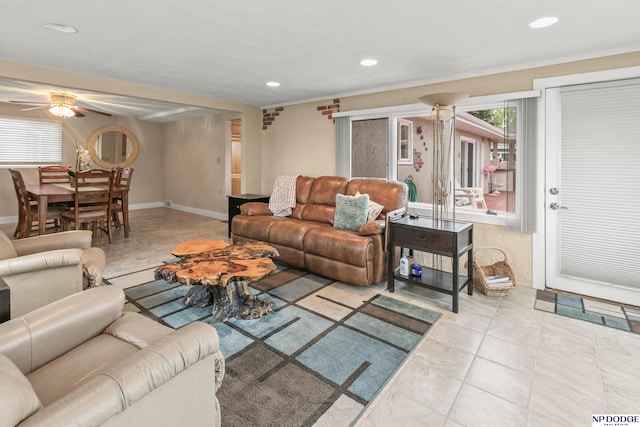 living area with ceiling fan, tile patterned floors, baseboards, and recessed lighting