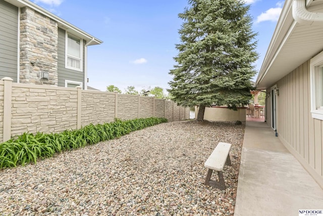 view of yard with a fenced backyard