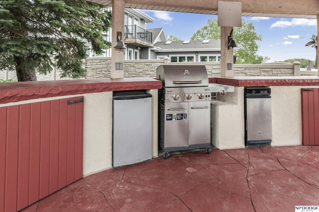 view of patio with a grill and exterior kitchen