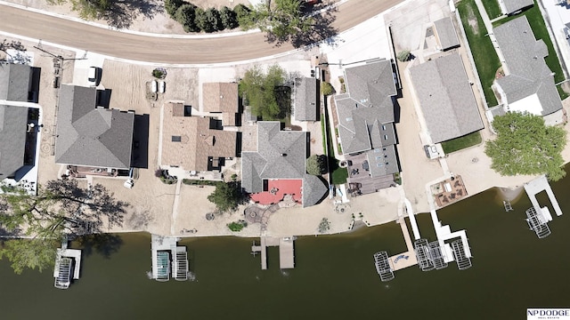 bird's eye view with a water view and a residential view