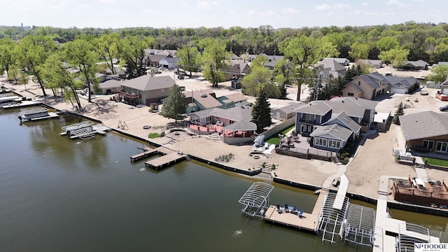 drone / aerial view featuring a water view and a residential view