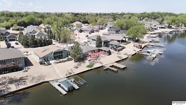 birds eye view of property with a water view and a residential view