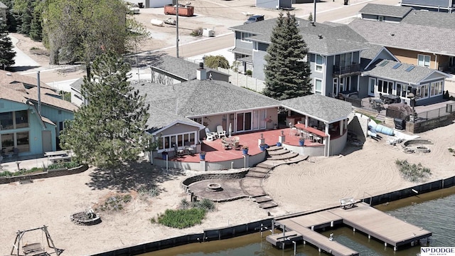 aerial view with a water view and a residential view