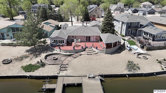 bird's eye view featuring a water view and a residential view