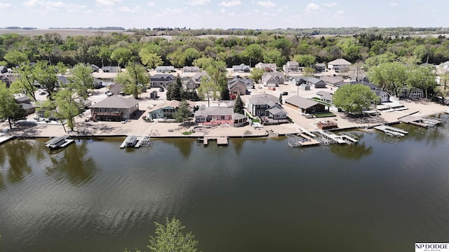 drone / aerial view featuring a water view and a residential view