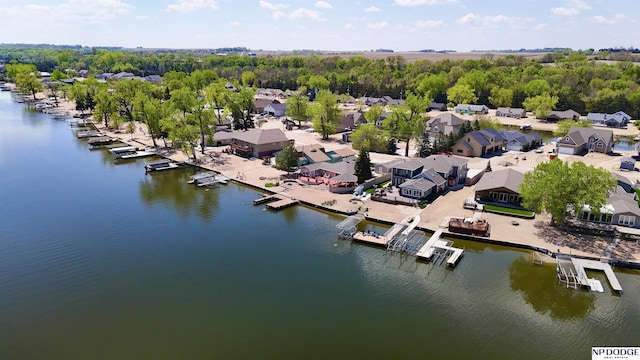 drone / aerial view with a water view and a residential view