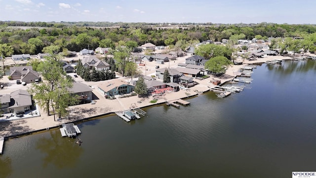 birds eye view of property with a water view and a residential view