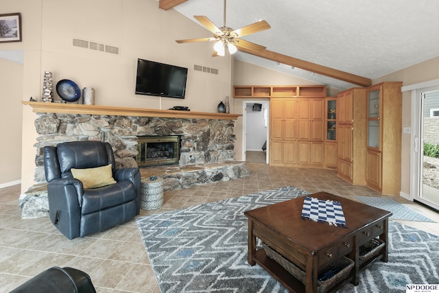 living room featuring light tile patterned floors, visible vents, a ceiling fan, and beam ceiling