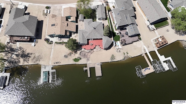 bird's eye view featuring a water view and a residential view