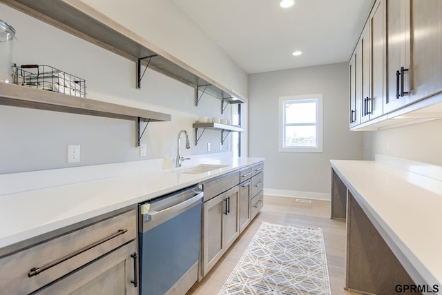 interior space with recessed lighting, light wood finished floors, a sink, wet bar, and baseboards