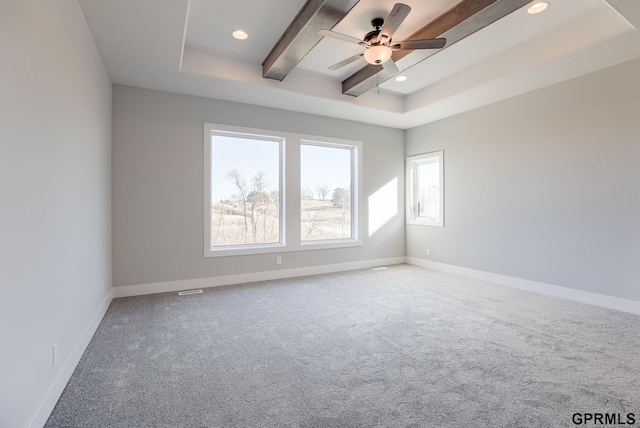 carpeted empty room featuring recessed lighting, a ceiling fan, a raised ceiling, and baseboards