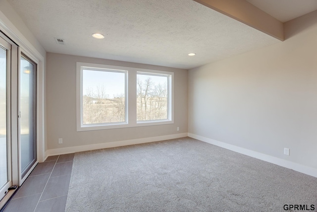 carpeted empty room with recessed lighting, visible vents, and baseboards