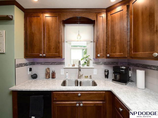 3615 N 60th St, Omaha, NE 68104 - kitchen featuring dishwasher, tasteful backsplash, brown cabinets, and light stone countertops