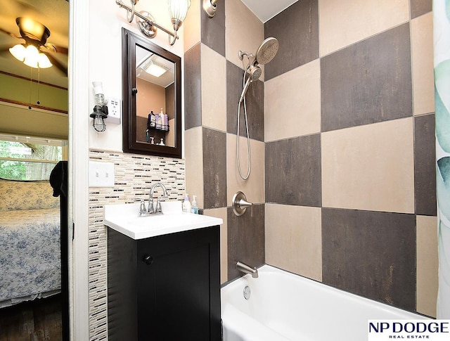 3615 N 60th St, Omaha, NE 68104 - ensuite bathroom featuring bathing tub / shower combination, vanity, and decorative backsplash