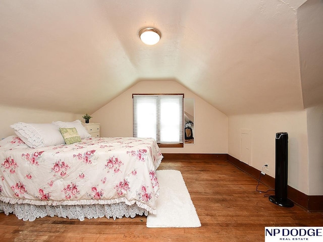 3615 N 60th St, Omaha, NE 68104 - bedroom with vaulted ceiling and wood finished floors