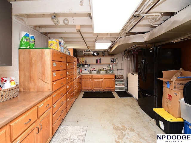 3615 N 60th St, Omaha, NE 68104 - below grade area featuring freestanding refrigerator