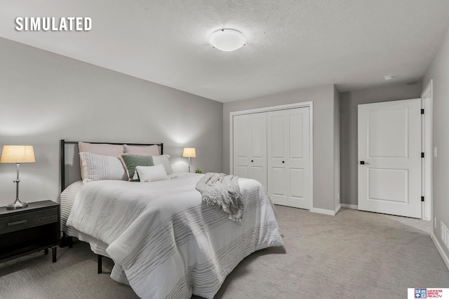 bedroom featuring baseboards, light carpet, a closet, and a textured ceiling