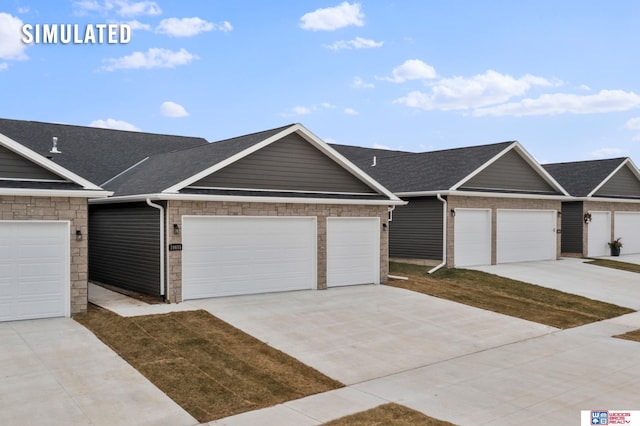 view of front of property with an attached garage, a shingled roof, stone siding, and concrete driveway