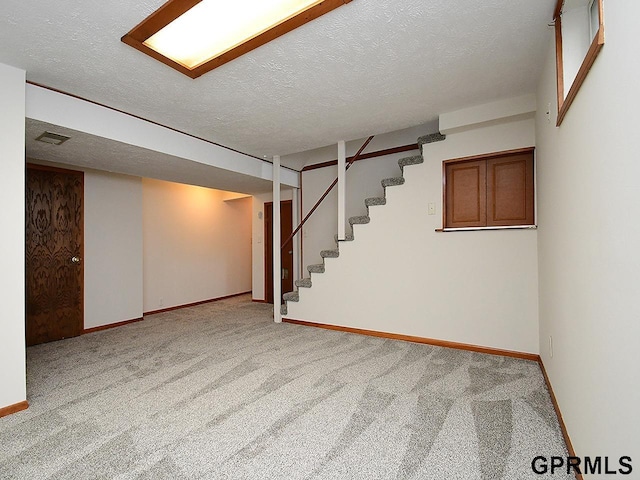 finished below grade area with carpet flooring and baseboards