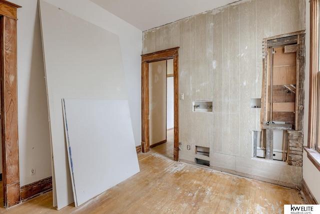 spare room with hardwood / wood-style flooring