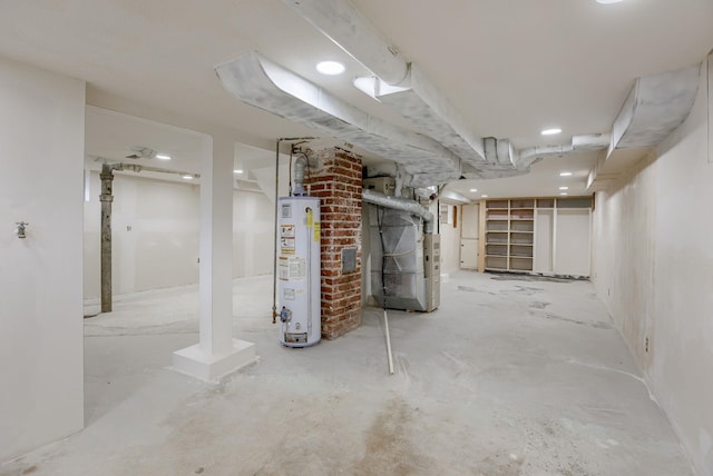 unfinished below grade area featuring gas water heater and heating unit