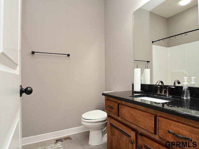 full bathroom featuring tile patterned flooring, toilet, vanity, and baseboards