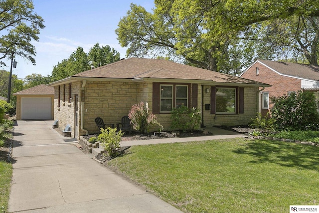 single story home with stone siding, driveway, a front yard, roof with shingles, and a detached garage
