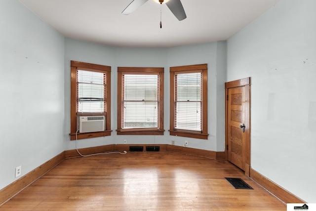 3218 Holdrege St, Lincoln, NE 68503 - spare room featuring light wood-style flooring, ceiling fan, baseboards, and cooling unit