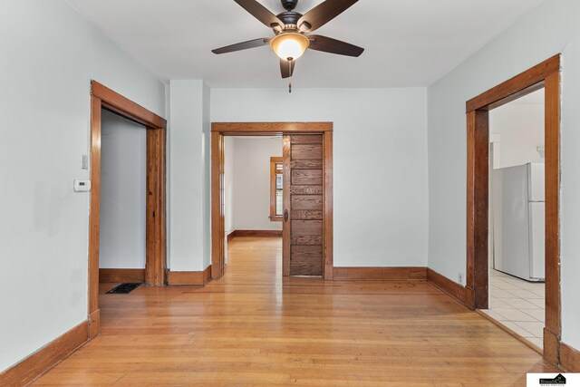 3218 Holdrege St, Lincoln, NE 68503 - hallway featuring light wood-style floors and baseboards
