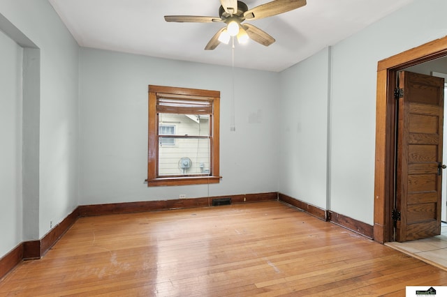 3218 Holdrege St, Lincoln, NE 68503 - unfurnished room with light wood-style floors, baseboards, and a ceiling fan
