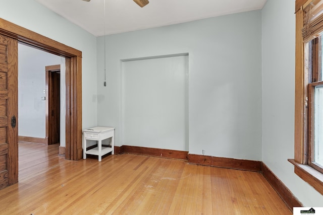 3218 Holdrege St, Lincoln, NE 68503 - empty room with light wood-style floors, baseboards, and ceiling fan