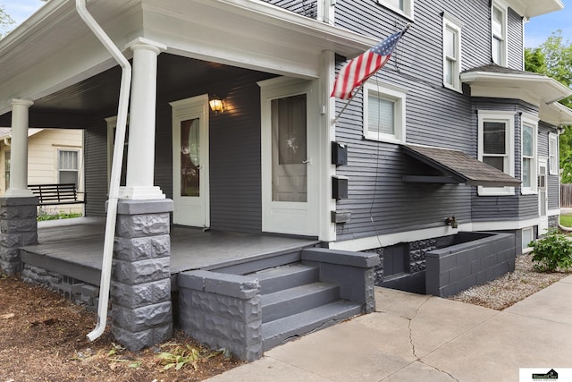 3218 Holdrege St, Lincoln, NE 68503 - entrance to property featuring a porch and roof with shingles