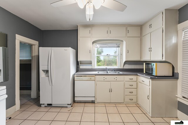3218 Holdrege St, Lincoln, NE 68503 - kitchen featuring white appliances, a sink, cream cabinetry, a ceiling fan, and light tile patterned flooring