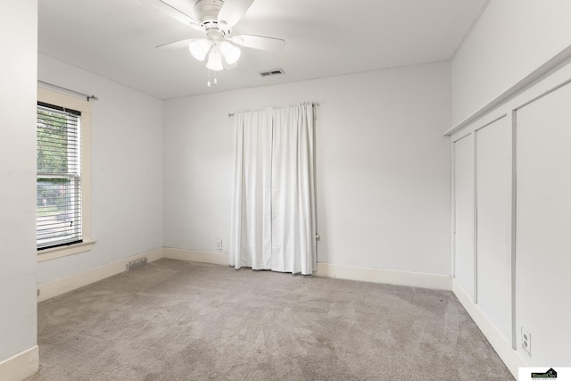 3218 Holdrege St, Lincoln, NE 68503 - unfurnished bedroom featuring carpet flooring, baseboards, and a ceiling fan