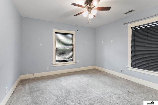 3218 Holdrege St, Lincoln, NE 68503 - carpeted empty room featuring a ceiling fan and baseboards