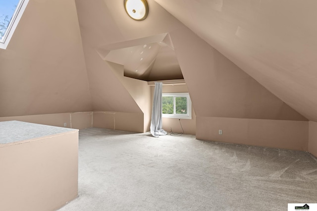 3218 Holdrege St, Lincoln, NE 68503 - additional living space with lofted ceiling and carpet