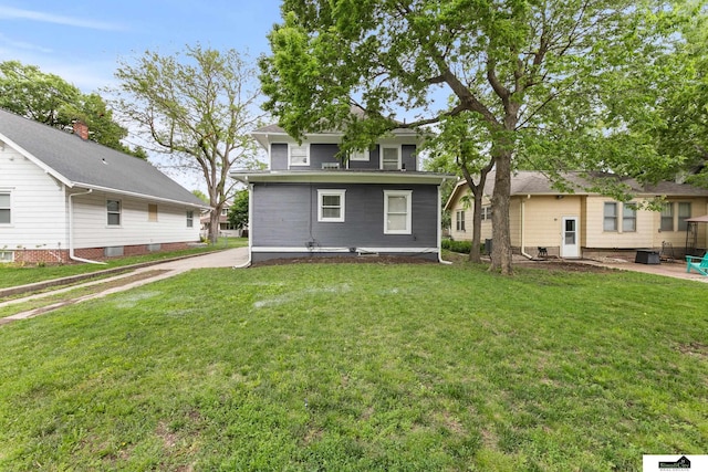 3218 Holdrege St, Lincoln, NE 68503 - rear view of house featuring a lawn