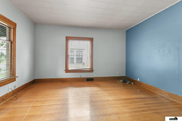3218 Holdrege St, Lincoln, NE 68503 - spare room featuring wood finished floors