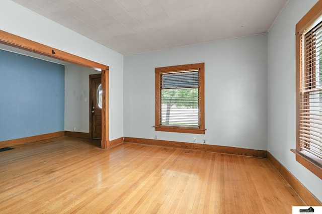 3218 Holdrege St, Lincoln, NE 68503 - spare room featuring light wood finished floors and baseboards